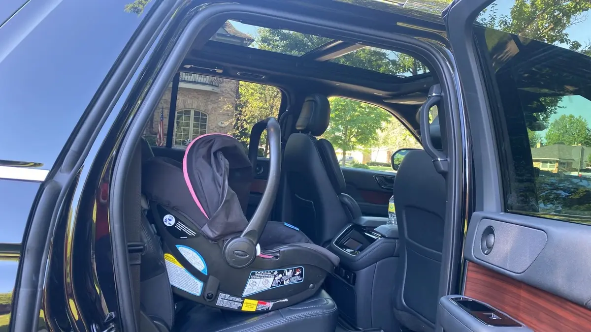 Child Car Seat installed in suv car