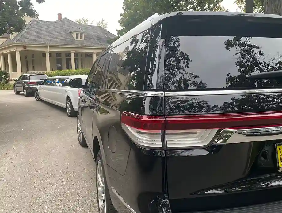 Black SUV with White MKT Limo