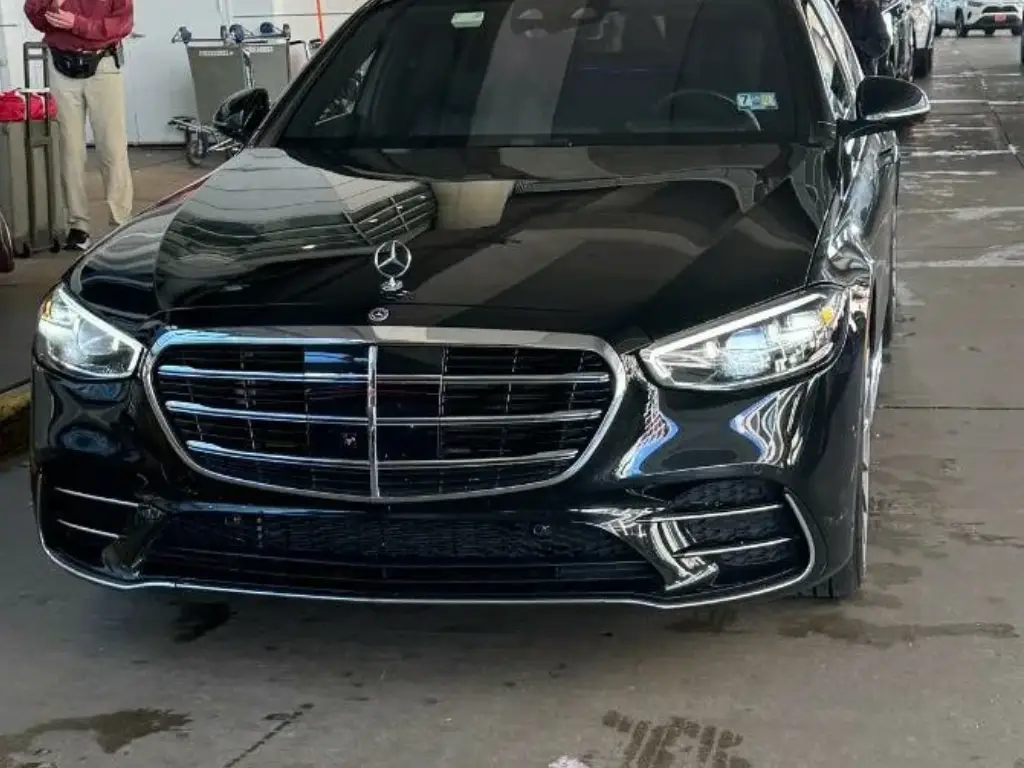 Black mercedes car at the curb-side