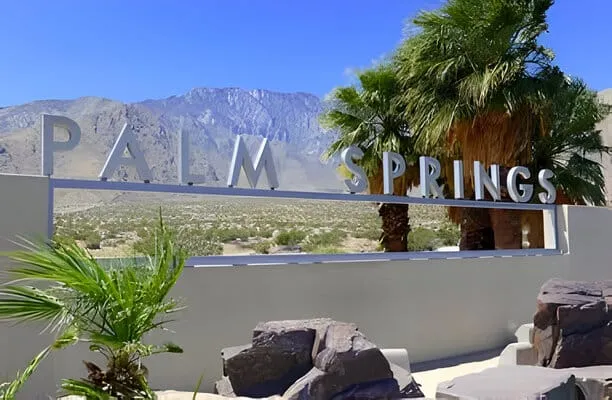 Palm Springs sign with desert background and backdrop of San Jacinto Mountain, California