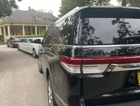 Black SUV with White MKT Limo